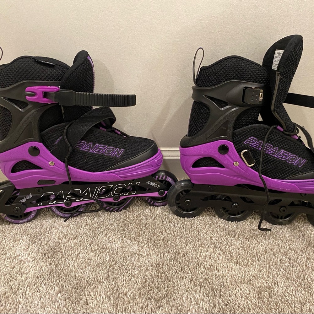 Women’s size large rollerblades , helmet, shoulder, knee & wrist pads.